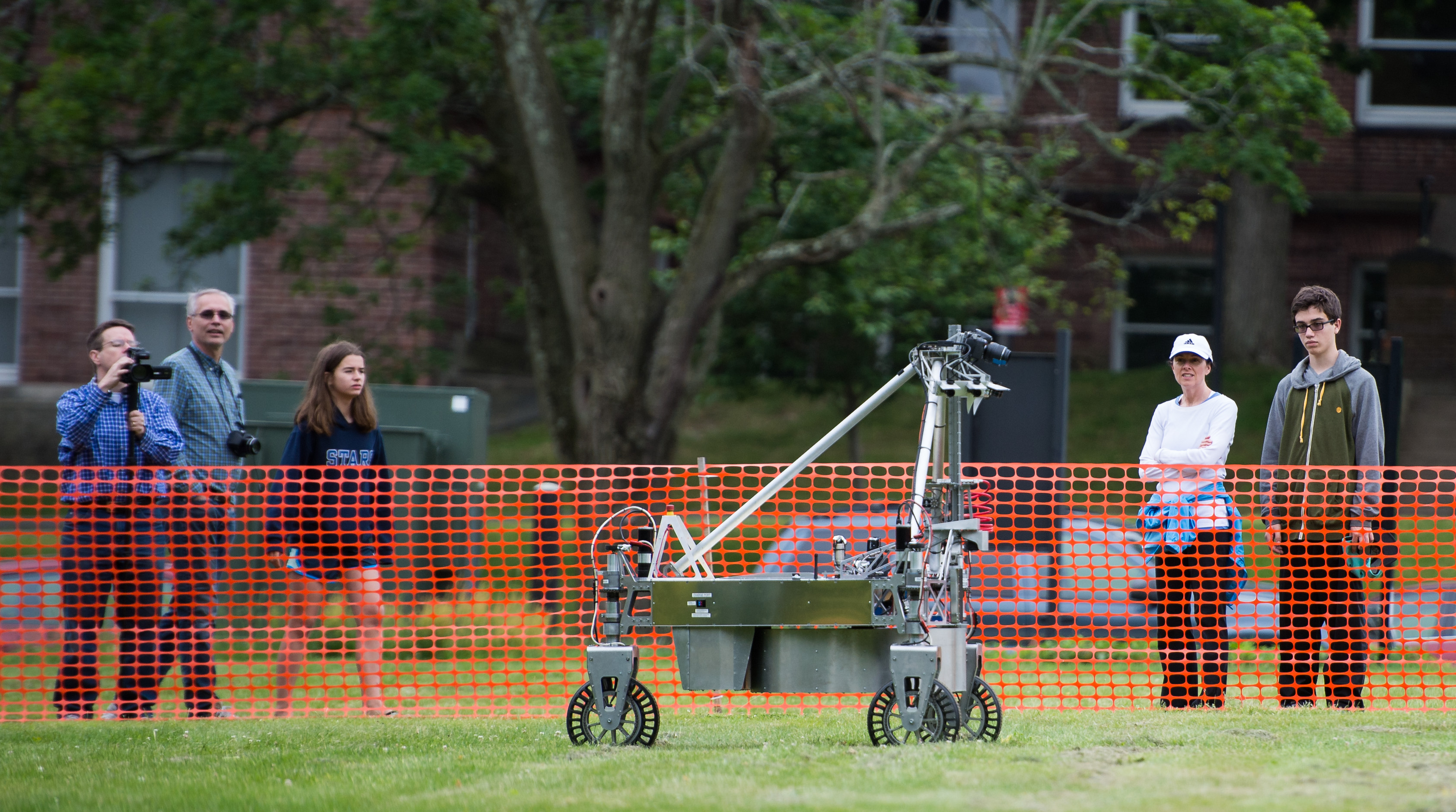 The team Survey robot is seen as it conducts a demonstration of the level two challenge during the 2014 NASA Centennial Challenges Sample Return Robot Challenge, Thursday, June 12, 2014, at the Worcester Polytechnic Institute (WPI) in Worcester, Mass.   Eighteen teams are competing for a $1.5 million NASA prize purse. Teams will be required to demonstrate autonomous robots that can locate and collect samples from a wide and varied terrain, operating without human control. The objective of this NASA-WPI Centennial Challenge is to encourage innovations in autonomous navigation and robotics technologies. Innovations stemming from the challenge may improve NASA's capability to explore a variety of destinations in space, as well as enhance the nation's robotic technology for use in industries and applications on Earth. Photo Credit: (NASA/Joel Kowsky)