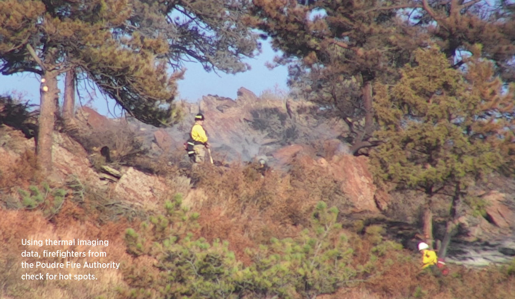 Using thermal imaging data, fi refi ghters from the Poudre Fire Authority check for hot spots.