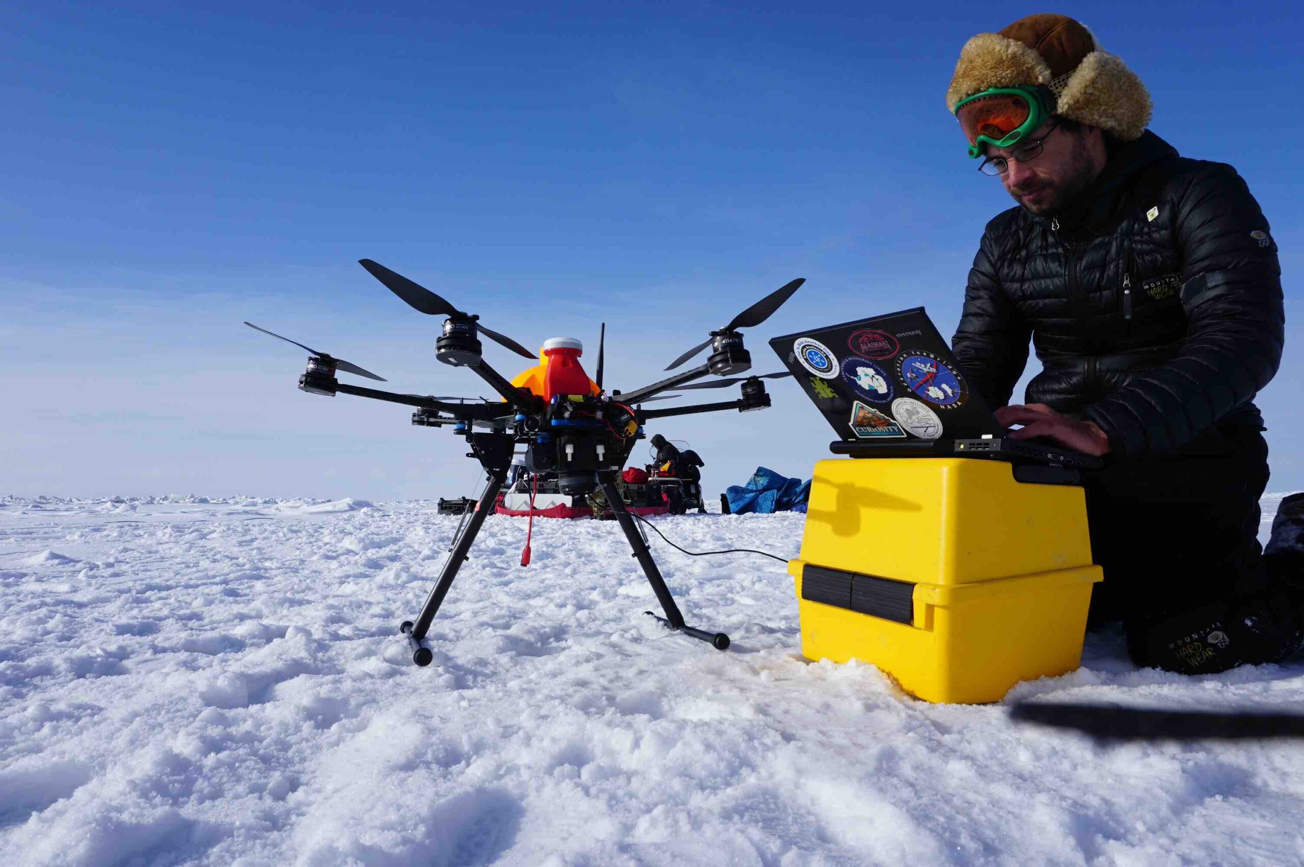 Researcher with drone in winter scene